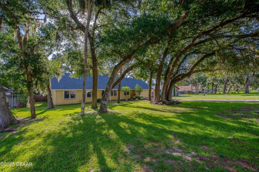 Nestled under the oaks, this expansive updated home offers - Beach Home for sale in Ormond Beach, Florida on Beachhouse.com