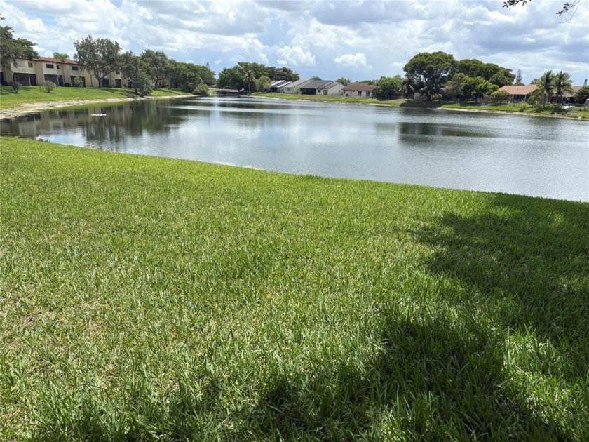 Enjoy serene lake views from this spacious 3-bed, 2.5-bath end - Beach Townhome/Townhouse for sale in Sunrise, Florida on Beachhouse.com