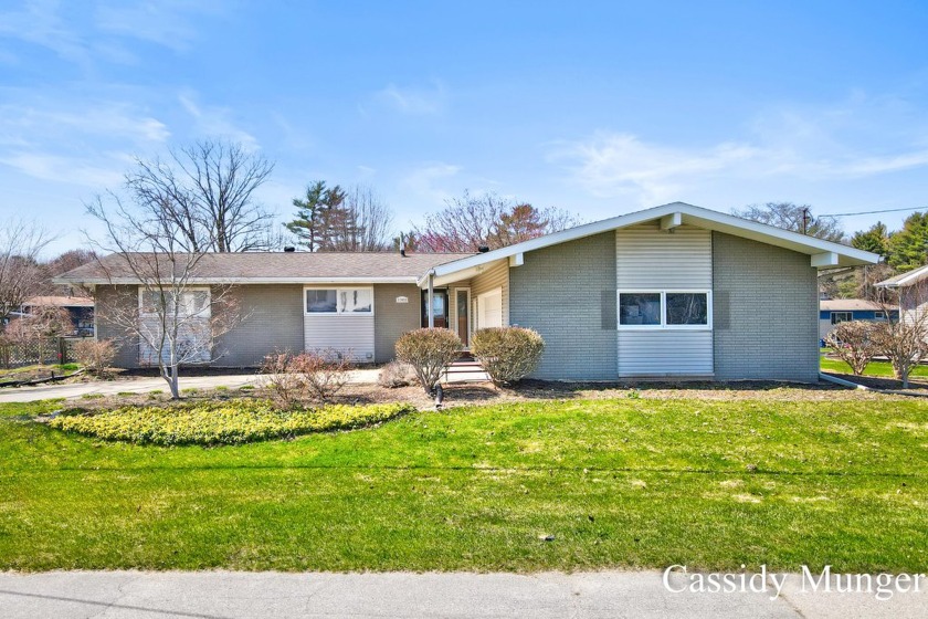 This waterfront masterpiece is located on beautiful Spring Lake- - Beach Home for sale in Spring Lake, Michigan on Beachhouse.com