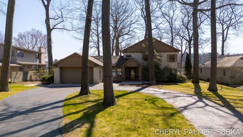 Stunning views on Bear Lake! Welcome to this two-story brick - Beach Home for sale in Muskegon, Michigan on Beachhouse.com