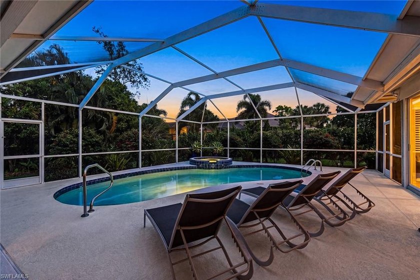 Set on an impressive 0.61-acre lot, this expansive and - Beach Home for sale in Bonita Springs, Florida on Beachhouse.com