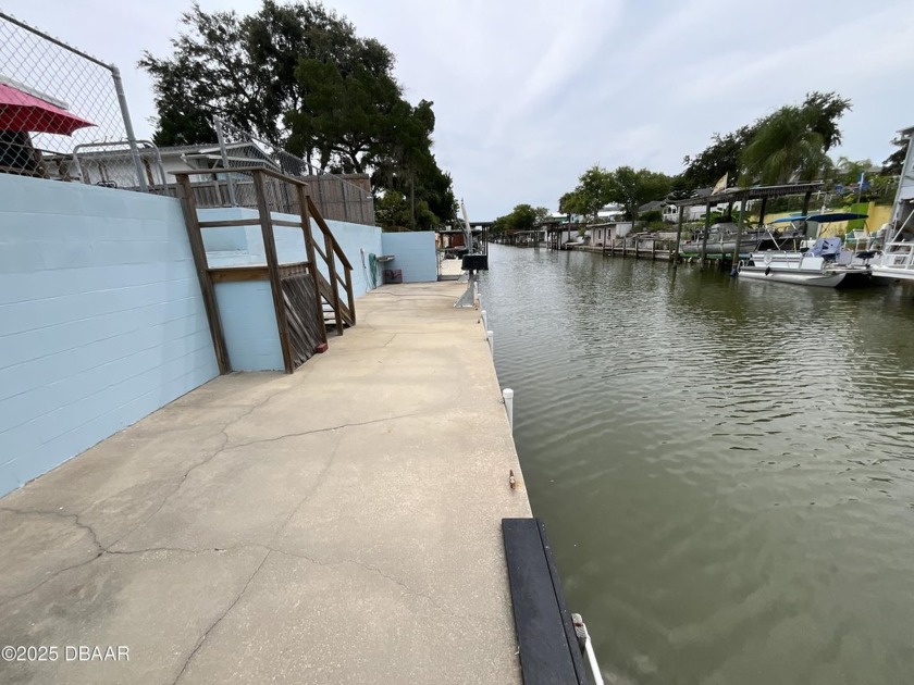 Must see! Tucked along a deep-water canal with direct access to - Beach Home for sale in Edgewater, Florida on Beachhouse.com