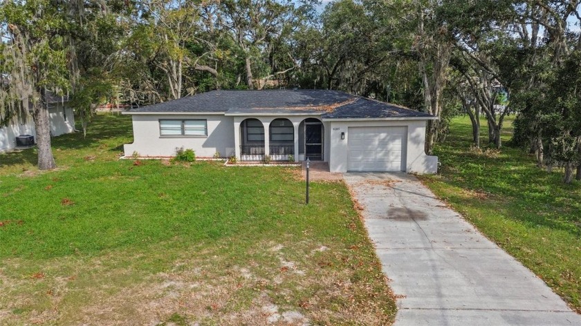 Nestled on nearly a quarter-acre, this beautifully renovated - Beach Home for sale in Spring Hill, Florida on Beachhouse.com