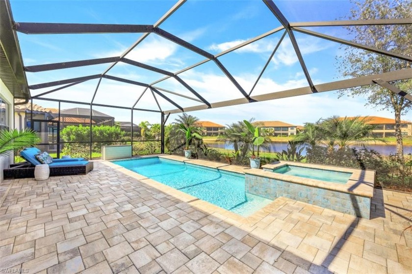 LIVE A VACATION LIFESTYLE IN ESPLANADE! Situated on oversized - Beach Home for sale in Naples, Florida on Beachhouse.com