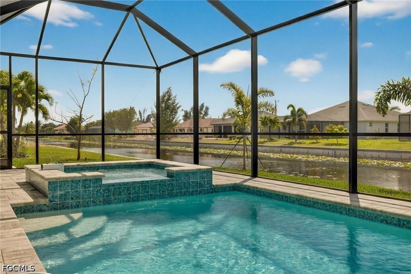 MOVE IN READY NEW CONSTRUCTION! 24-FOOT SLIDING GLASS DOOR WITH - Beach Home for sale in Cape Coral, Florida on Beachhouse.com