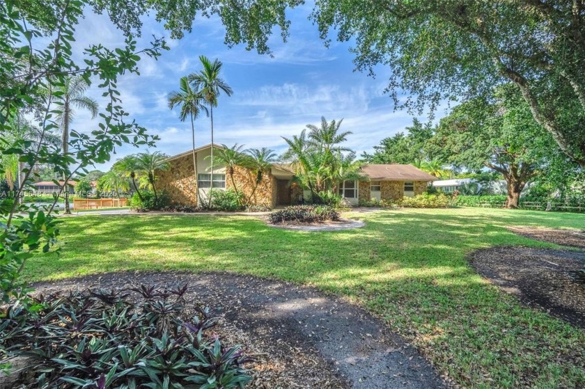 This remarkable 3-bedroom, 2-bath lakefront pool home is in the - Beach Home for sale in Davie, Florida on Beachhouse.com