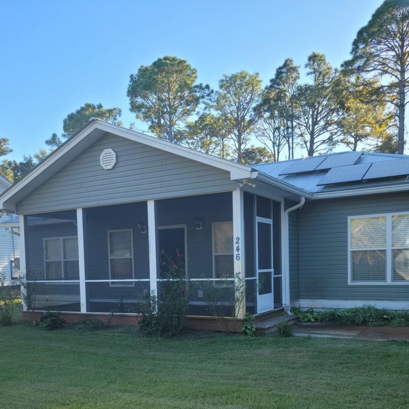 Make this YOUR home. The screened front porch invites you to - Beach Home for sale in Apalachicola, Florida on Beachhouse.com