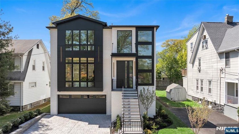 FRAMED BY A PICTURESQUE, PARK LIKE MEDIAN, THIS NEW CONSTRUCTION - Beach Home for sale in Fort Lee, New Jersey on Beachhouse.com
