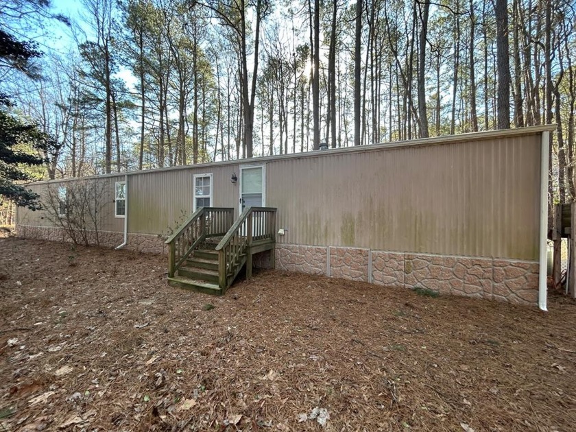 Motivated Seller! This mobile home is located on a wooded lot - Beach Home for sale in Heathsville, Virginia on Beachhouse.com
