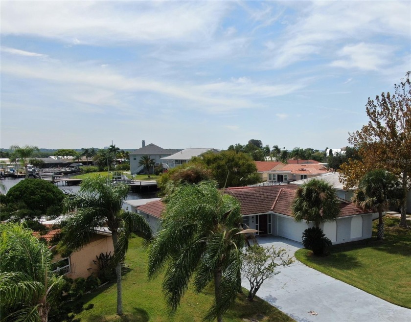 Enjoy waterfront living in this move-in ready 3 Bed 3 bath home - Beach Home for sale in New Port Richey, Florida on Beachhouse.com
