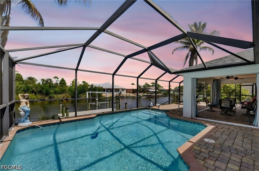 Step into a waterfront retreat where every detail has already - Beach Home for sale in Port Charlotte, Florida on Beachhouse.com