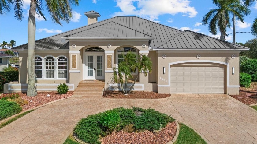 Discover this stunning former model home, located on an - Beach Home for sale in Punta Gorda, Florida on Beachhouse.com