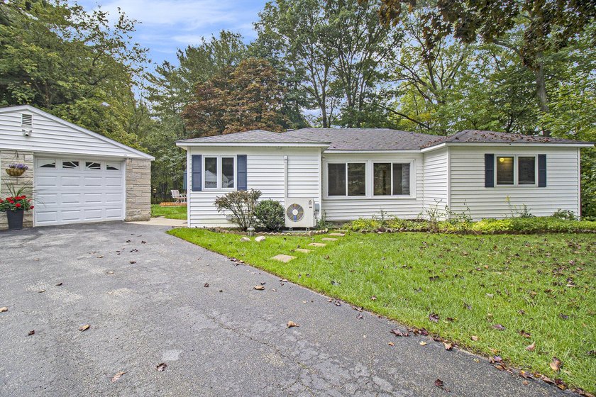 HAMLIN TOWNSHIP - This 3-bedroom, 2-bath home sits on 1.5 wooded - Beach Home for sale in Ludington, Michigan on Beachhouse.com