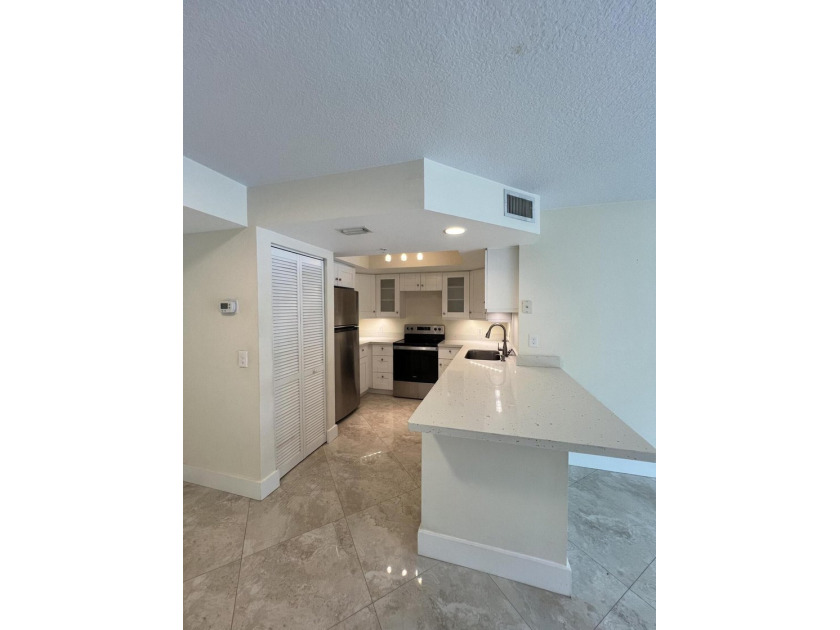 Welcome to resort-style living in Grand Isles Condominium! This - Beach Condo for sale in West Palm Beach, Florida on Beachhouse.com