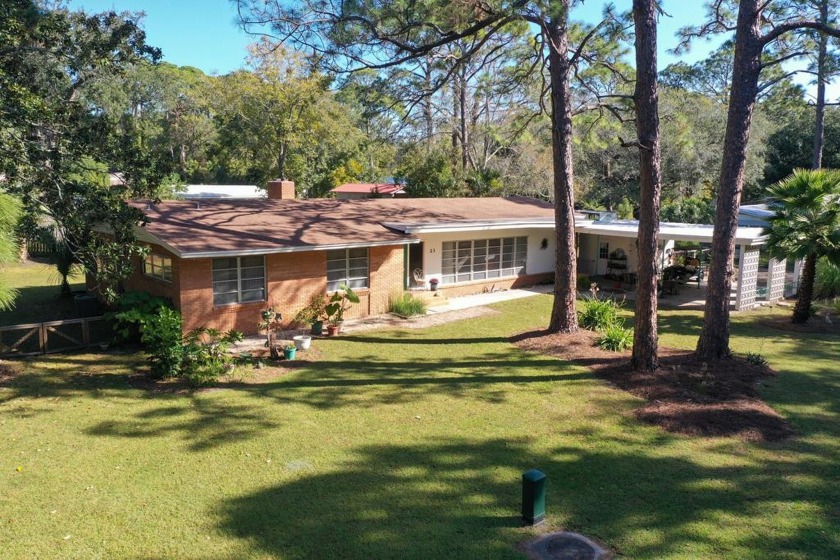 Come see this Mid-Century Modern Rambler! This 4-bedroom, 3-bath - Beach Home for sale in Apalachicola, Florida on Beachhouse.com