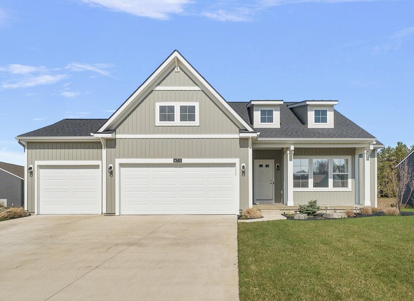 Thoughtfully designed with quality finishes throughout, this - Beach Home for sale in Grand Haven, Michigan on Beachhouse.com