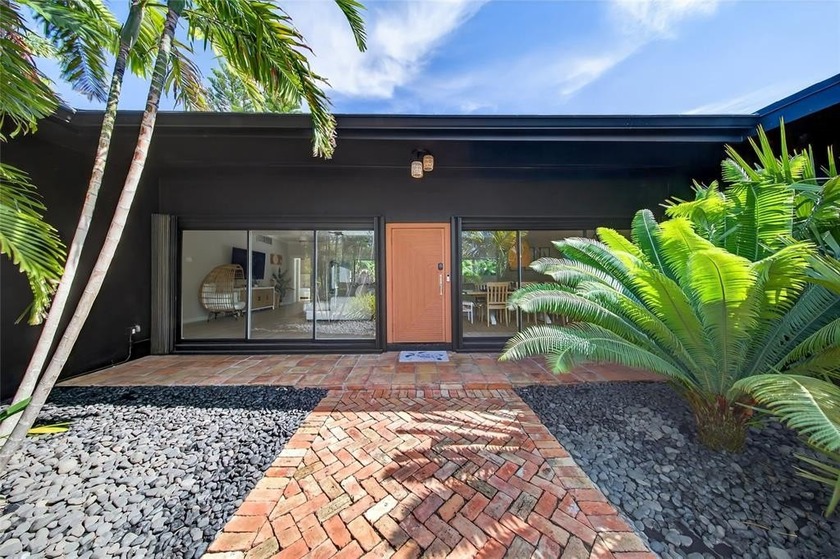 Perched on a ridge and surrounded by lush tropical greenery - Beach Home for sale in Fort Lauderdale, Florida on Beachhouse.com