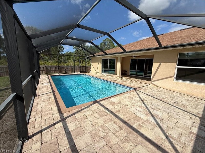 Welcome to this stunning 2017 built pool home nestled on a fully - Beach Home for sale in Lehigh Acres, Florida on Beachhouse.com