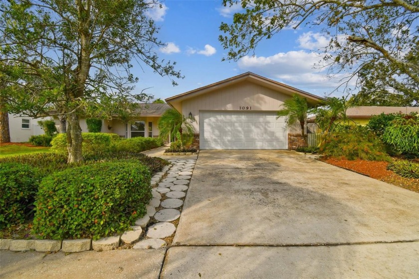 Discover this stunning three-bedroom, two-bathroom pool home in - Beach Home for sale in Palm Harbor, Florida on Beachhouse.com