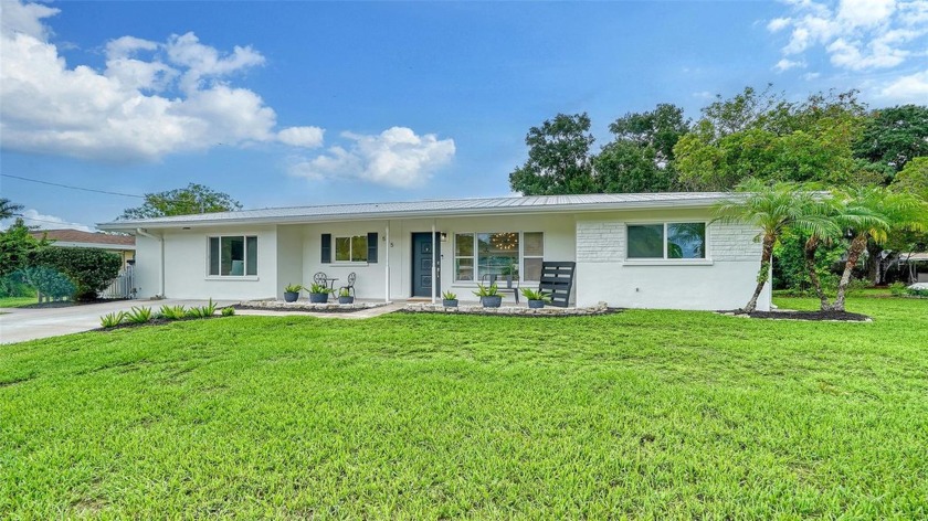 Come home to beautifully appointed and light-filled lake front - Beach Home for sale in Sarasota, Florida on Beachhouse.com