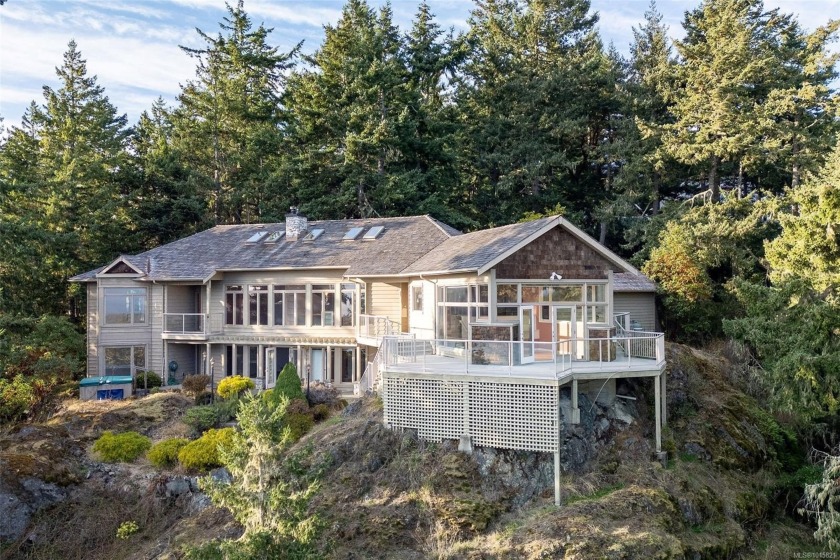 Perched atop Mount Matheson, this custom-built, architecturally - Beach Home for sale in Sooke,  on Beachhouse.com
