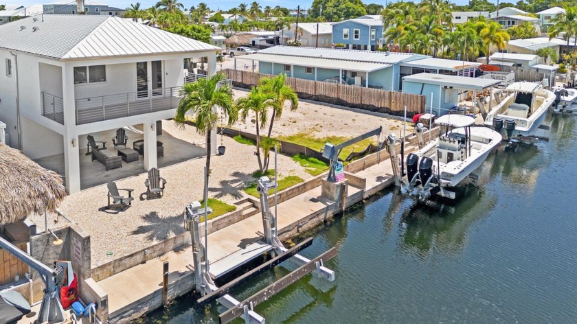 Experience waterfront luxury in this turnkey, CBS-built coastal - Beach Home for sale in Key Largo, Florida on Beachhouse.com