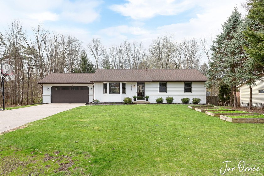 Beautifully updated walk-out ranch on 0.58 acres w/ frontage on - Beach Home for sale in Holland, Michigan on Beachhouse.com