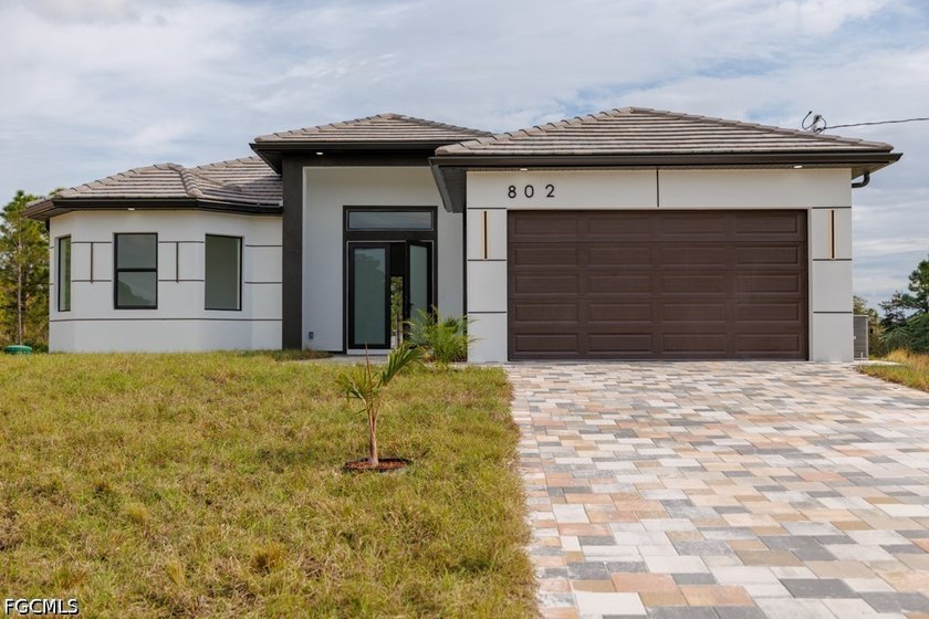 Elegant new construction, 0.50 ACRE LOT featuring porcelain tile - Beach Home for sale in Lehigh Acres, Florida on Beachhouse.com