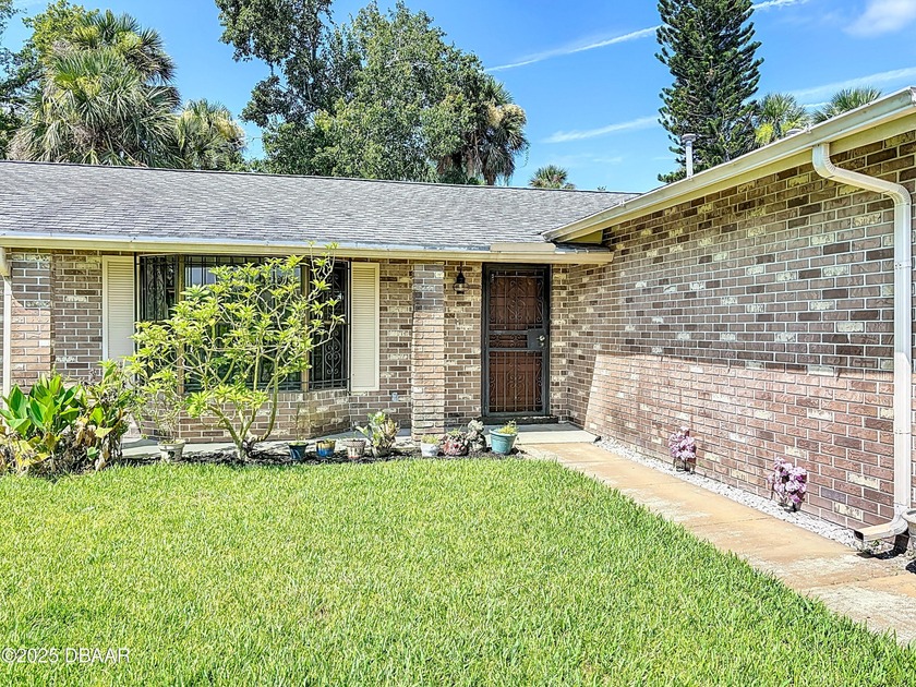 From the moment you step onto the covered front porch, you can - Beach Home for sale in Daytona Beach, Florida on Beachhouse.com