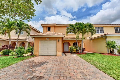 Nestled within a secure, gated community, this home offers three - Beach Home for sale in West Palm Beach, Florida on Beachhouse.com