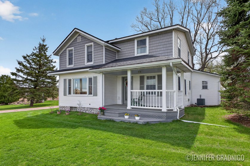 Classic farmhouse charm meets modern comfort on this picturesque - Beach Home for sale in Holland, Michigan on Beachhouse.com
