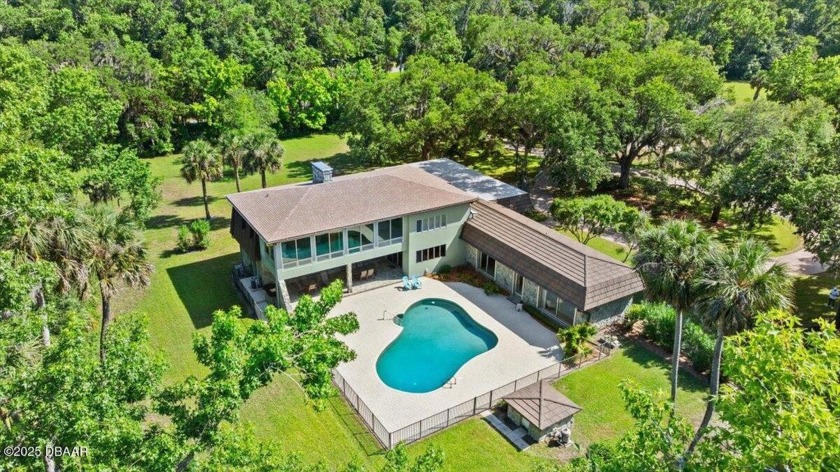 A COMPLETELY FENCED, CUSTOM ESTATE SITUATED ON NEARLY 2.5 ACRES - Beach Home for sale in Daytona Beach, Florida on Beachhouse.com