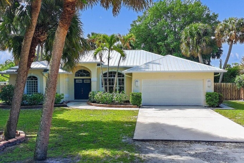 Set on a lush half-acre in Stuart, this lake side residence - Beach Home for sale in Stuart, Florida on Beachhouse.com