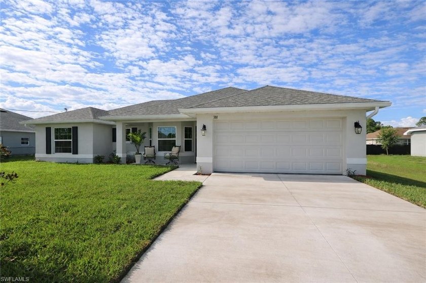 Discover this beautifully maintained open-concept home tucked - Beach Home for sale in Lehigh Acres, Florida on Beachhouse.com