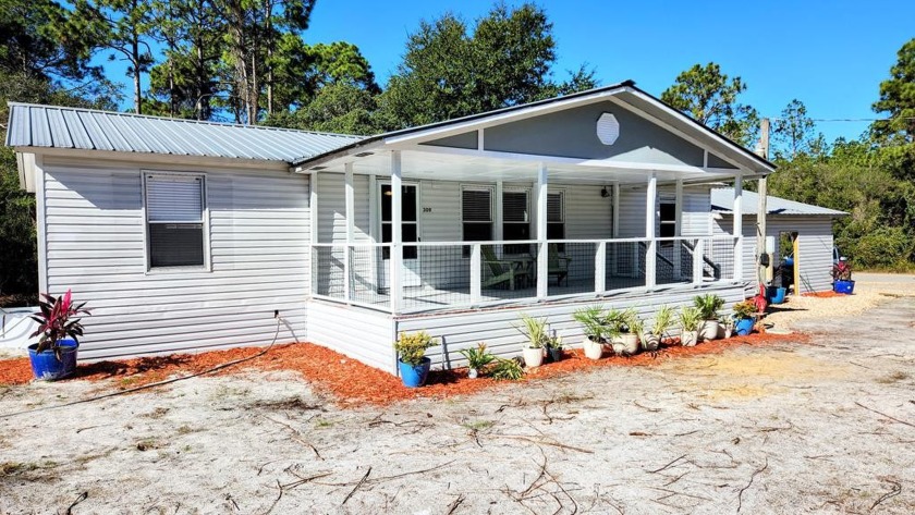 Nestled in the charming town of Carrabelle, this inviting - Beach Home for sale in Carabelle, Florida on Beachhouse.com