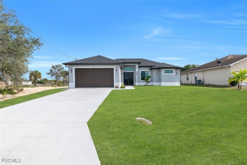 Discover exceptional value in this stunning new construction - Beach Home for sale in Lehigh Acres, Florida on Beachhouse.com
