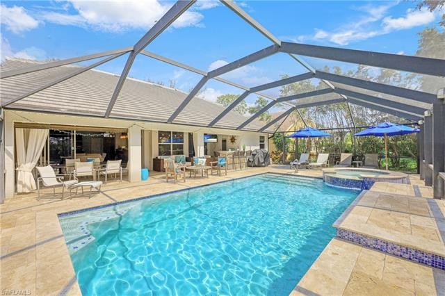 Own a RARELY AVAILABLE oversized pool home in the highly sought - Beach Home for sale in Naples, Florida on Beachhouse.com