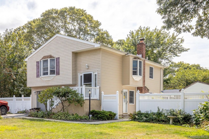 Discover this charming Hi-Ranch home featuring three main-floor - Beach Home for sale in Shirley, New York on Beachhouse.com