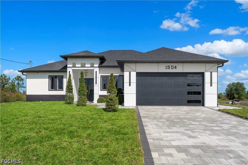 Stunning new construction completed in 2026, situated on an - Beach Home for sale in Lehigh Acres, Florida on Beachhouse.com