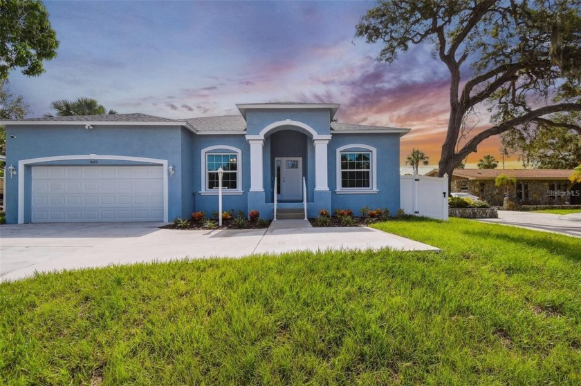 This newly built, block construction 4-bedroom, 2-bath home with - Beach Home for sale in Seminole, Florida on Beachhouse.com