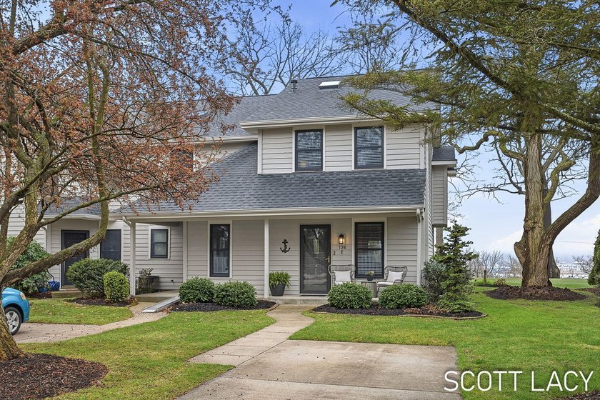 Perched on The Hill in Saugatuck, this exceptional end-unit - Beach Condo for sale in Saugatuck, Michigan on Beachhouse.com