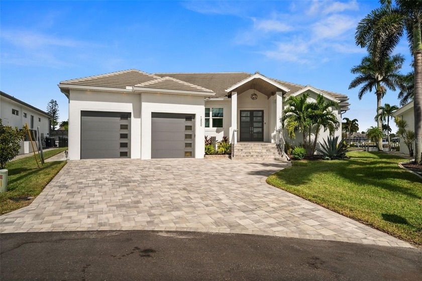 STUNNING HOME with 140 FEET OF WATERFRONTAGE, featuring a - Beach Home for sale in Punta Gorda, Florida on Beachhouse.com