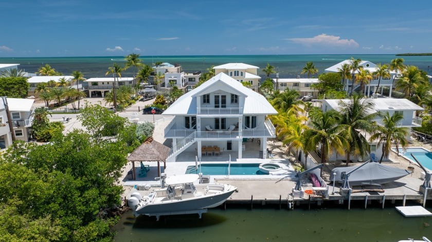 Welcome to your private waterfront retreat. This 4-bedroom - Beach Home for sale in Key Largo, Florida on Beachhouse.com