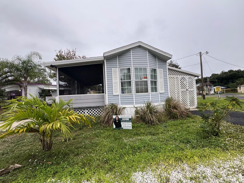 Nestled on a desirable corner lot, this home boasts a - Beach Home for sale in Melbourne, Florida on Beachhouse.com
