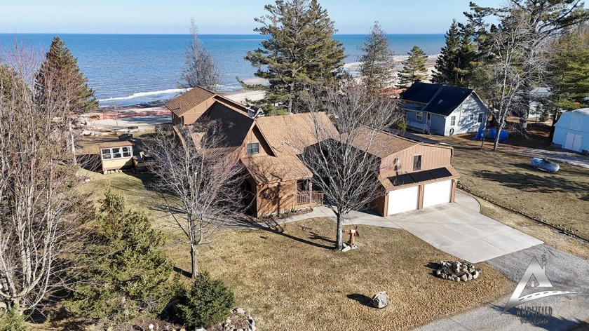 Discover the epitome of modern living in this 4 bedroom 3 - Beach Home for sale in Black River, Michigan on Beachhouse.com