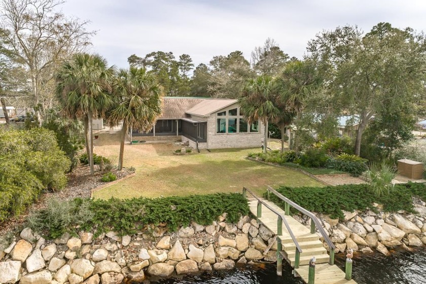 100' River frontage, 10,000 pound boat lift and 14' deep at dock - Beach Home for sale in Carabelle, Florida on Beachhouse.com