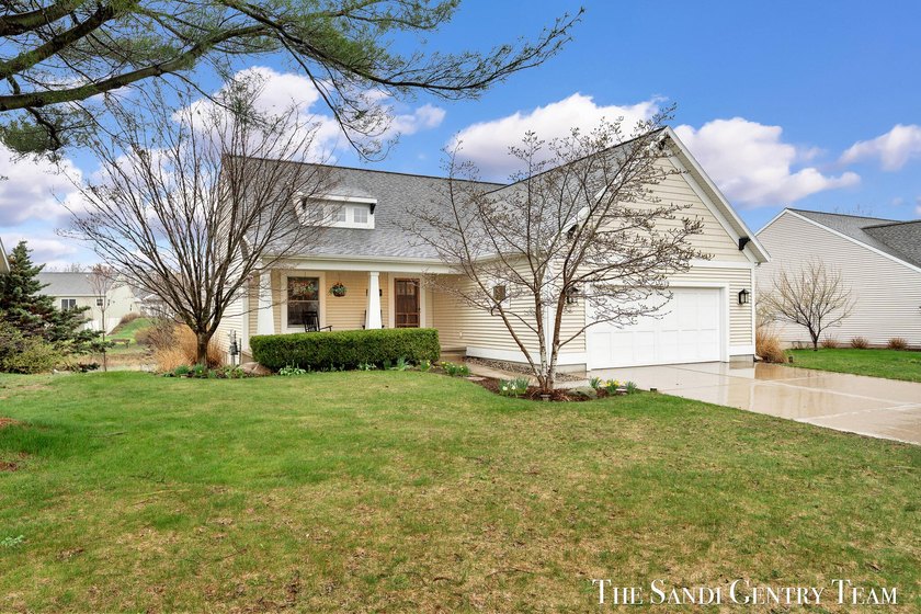 Exceptional curb appeal welcomes you to this beautifully - Beach Home for sale in Grand Haven, Michigan on Beachhouse.com