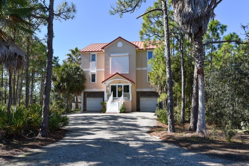 Welcome to *Sandy Paws* a spacious Mediterranean style home - Beach Home for sale in St. George Island, Florida on Beachhouse.com