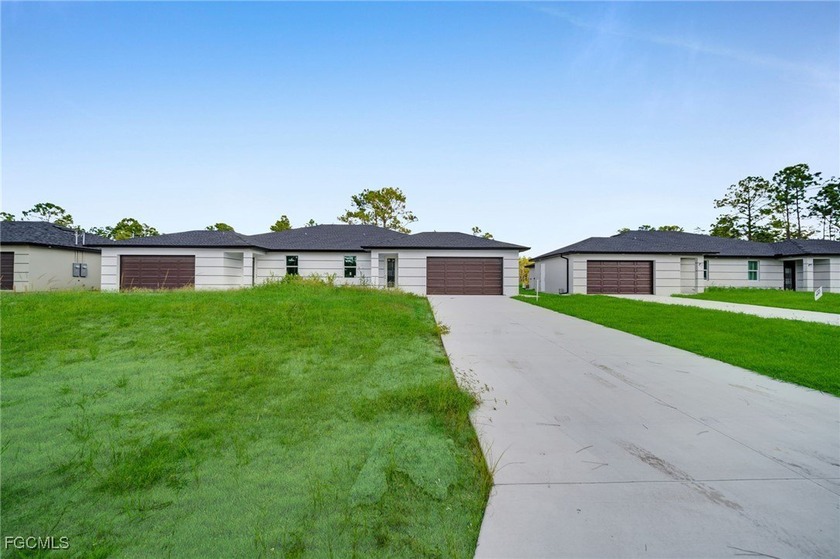 Discover this stunning modern duplex featuring high-end finishes - Beach Home for sale in Lehigh Acres, Florida on Beachhouse.com