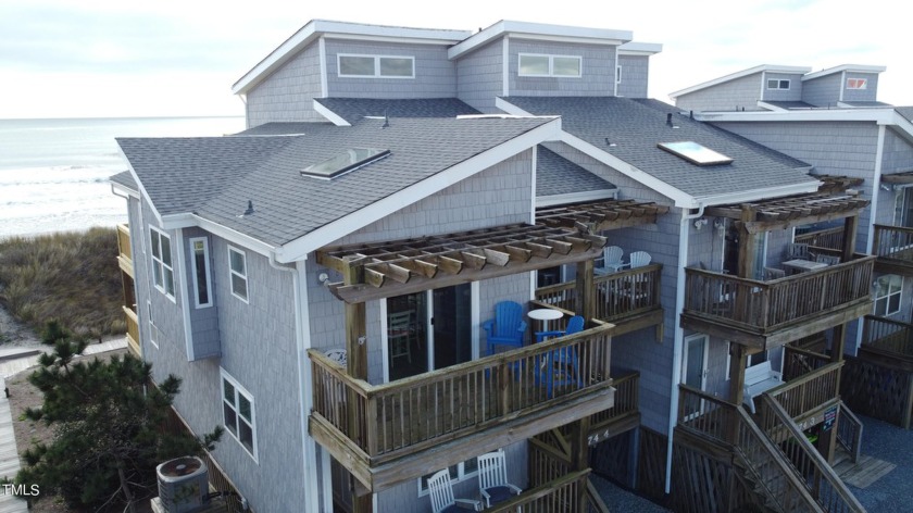 Discover beachfront bliss in this luxurious two-bedroom condo - Beach Home for sale in North Topsail Beach, North Carolina on Beachhouse.com
